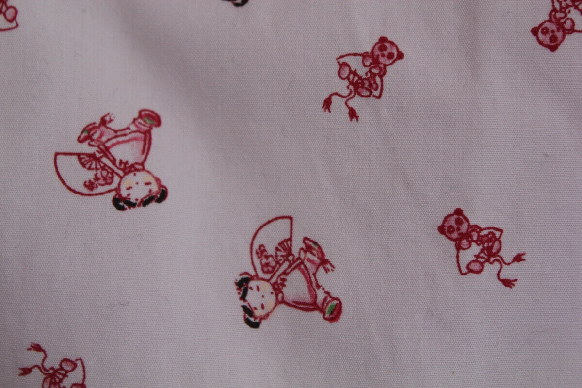 preloved katoenen mouwloze lichtroze slaapzak met japanse popjes in maat 56-62 voor een baby meisje van petit bateau
