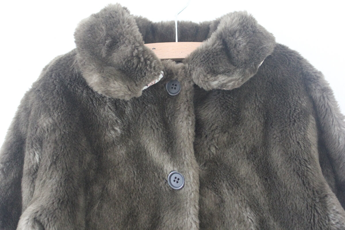 tweedehands donkergroene fake fur jas van bonpoint maat 110-116 voor een meisje