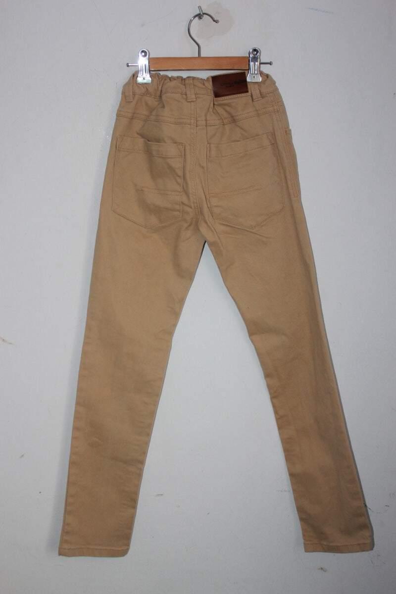 tweedehands unisex mosterdgele lange broek in maat 140 van cyrillus