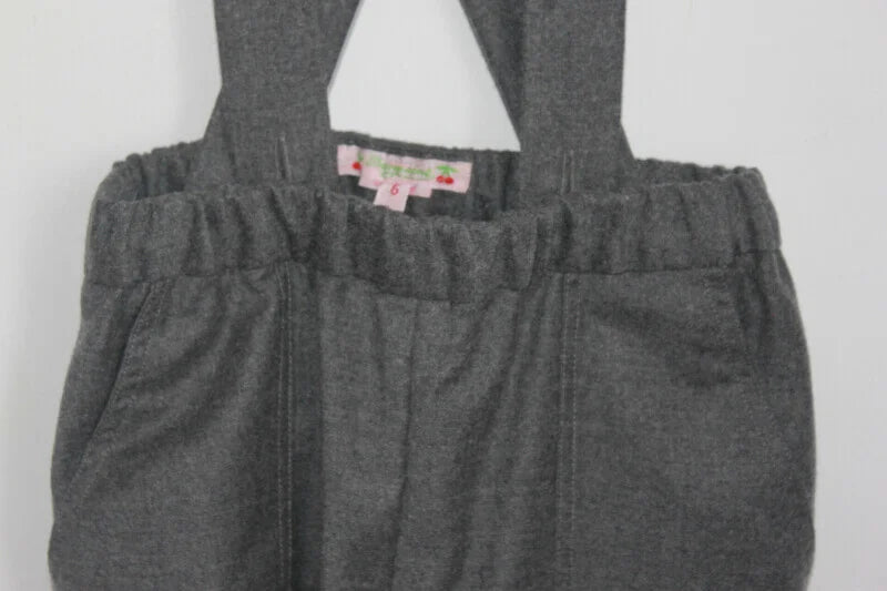 tweedehands grijze wollen lange broek met schouderbanden van bonpoint, maat 110-116 voor een meisje