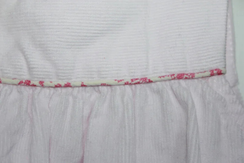 tweedehands roze katoenen ribfluwelen mouwloze jacadi jurk in maat 74