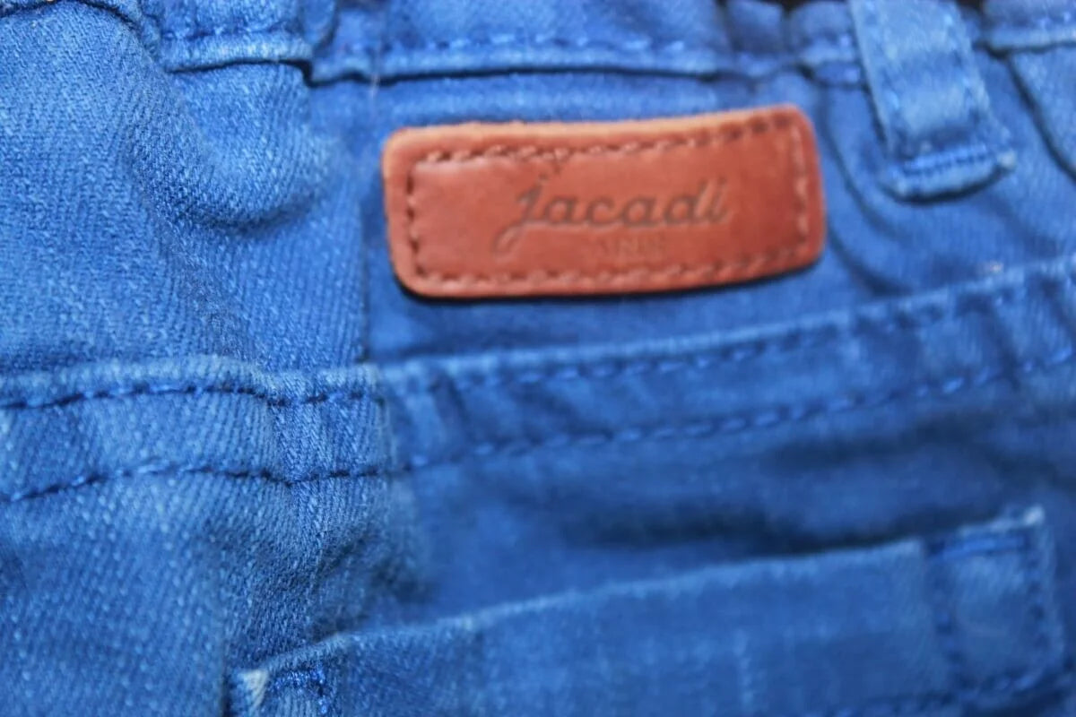 tweedehands unisex blauwe lange jacadi broek in maat 104