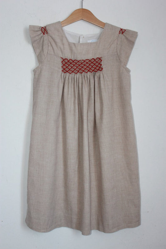 tweedehands beige met rood gesmokte
zomerse jurk met korte mouwen in maat 140 voor een meisje van jacadi