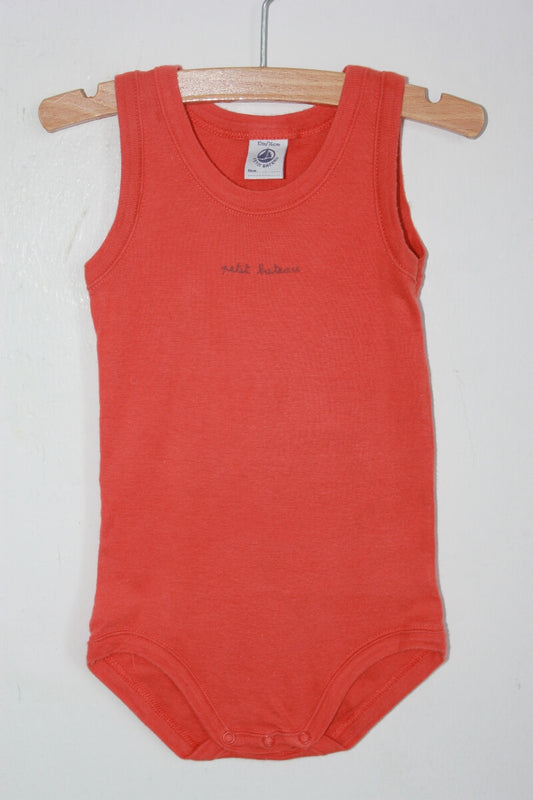 tweedehands-oranje-mouwloze-romper-maat-74-baby-petit-bateau