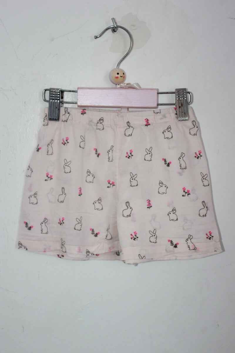 tweedehands zomerse lichtroze pyjama  met konijntjes in maat 98-104 van monoprix