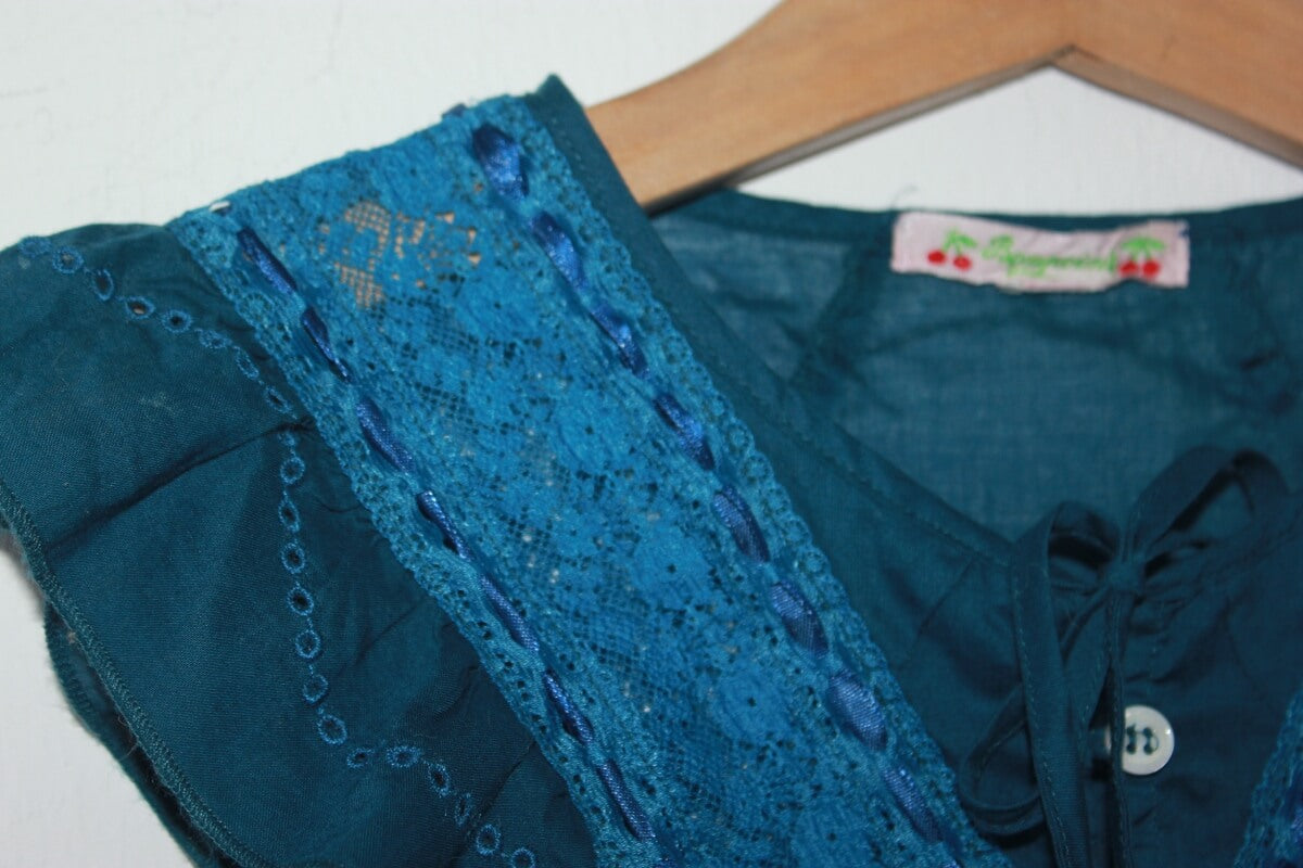 tweedehands groenblauwe mouwloze blouse van bonpoint in maat 116 voor een meisje