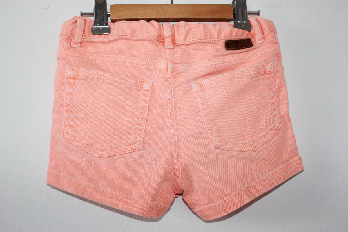 tweedehands zomerse licht oranje korte broek van bonpoint in maat 110-116 voor een meisje