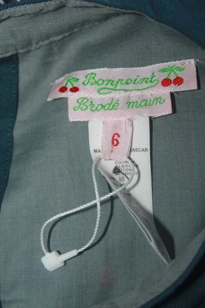 preloved katoenen donkergrijze jurk met koraalrode details en lange mouwen van bonpoint, maat 110-116