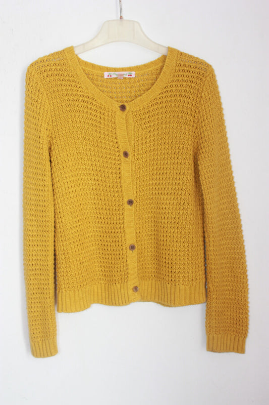 tweedehands mosterdgeel ajour vest in maat 122-128 voor een meisje van bonpoint