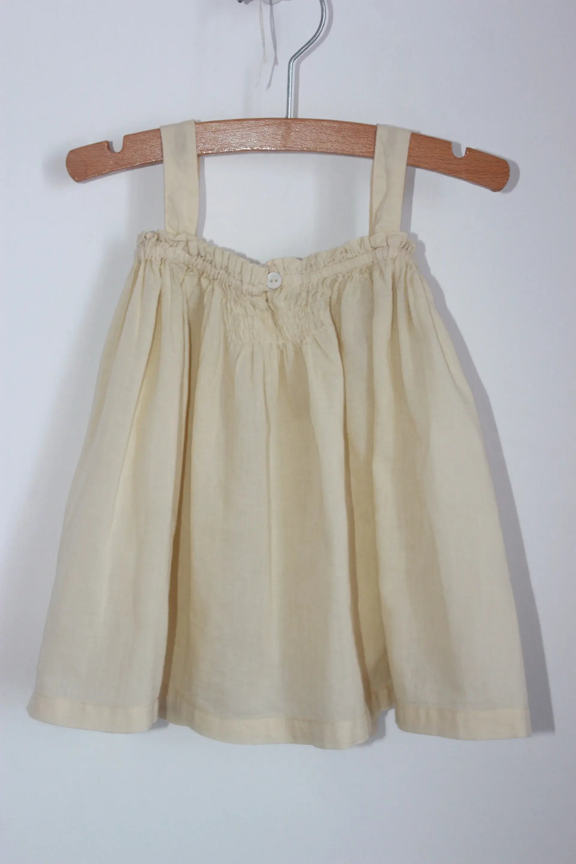 tweedehands katoenen zomerse cremegele, of lichtbeige, jurk met schouderbandjes van bonton in maat 68