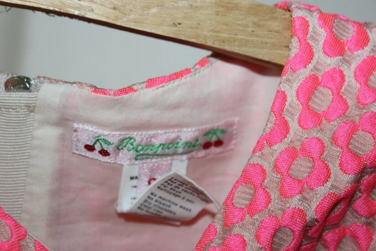 preloved creme jurk met fluo-roze bloemen en korte mouwen van bonpoint in maat 122-128